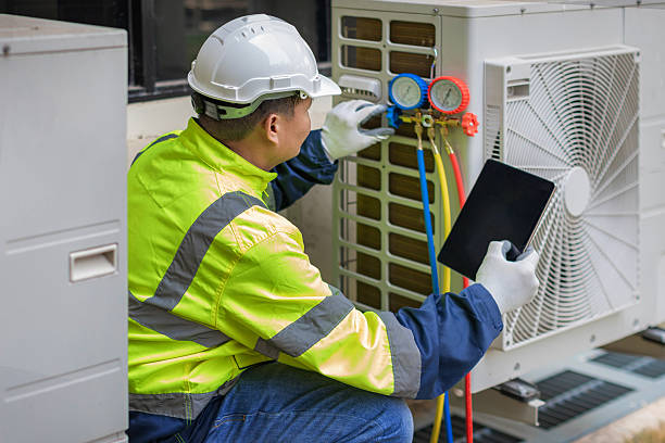 Professional Air Duct Cleaning technician working in South Weymouth, MA